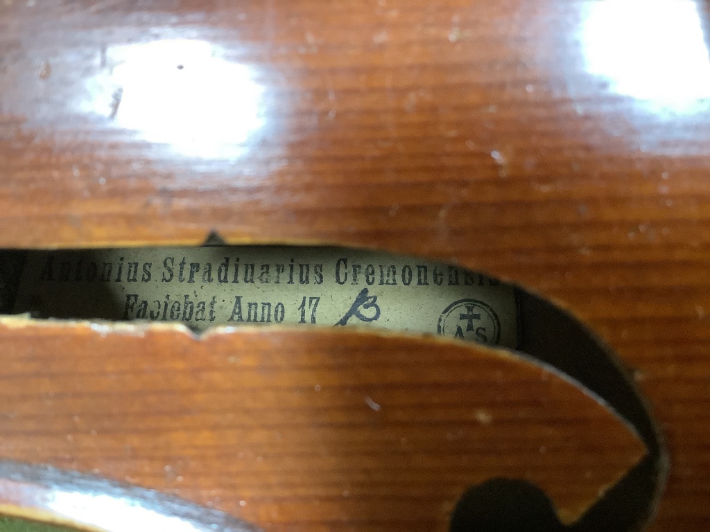 A violin and bow, in case, label to interior read Antonius Stadivarius Cremonensis, made in Czechoslovakia